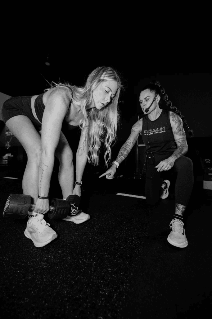 HYROX instructor coaching an athlete